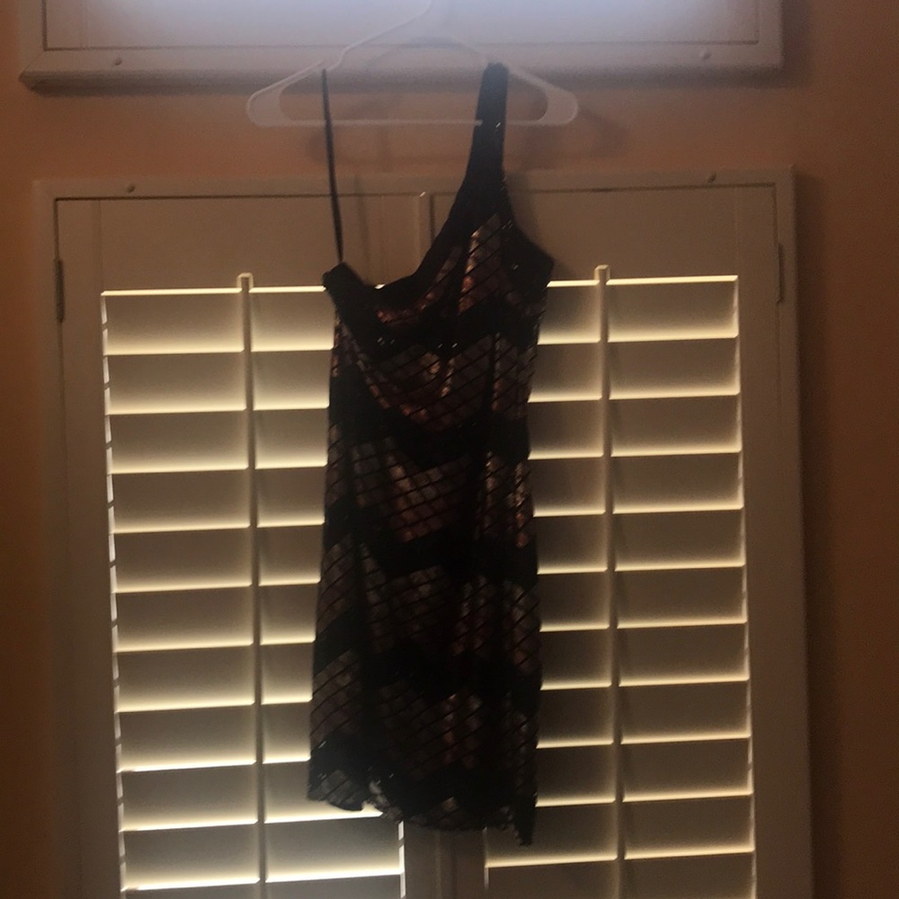 Copper, gold, and black sequin one shoulder dress.